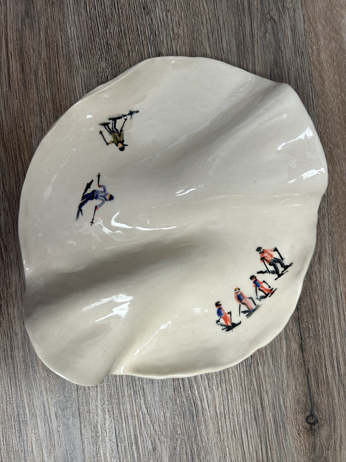 Hand-painted skiers plate